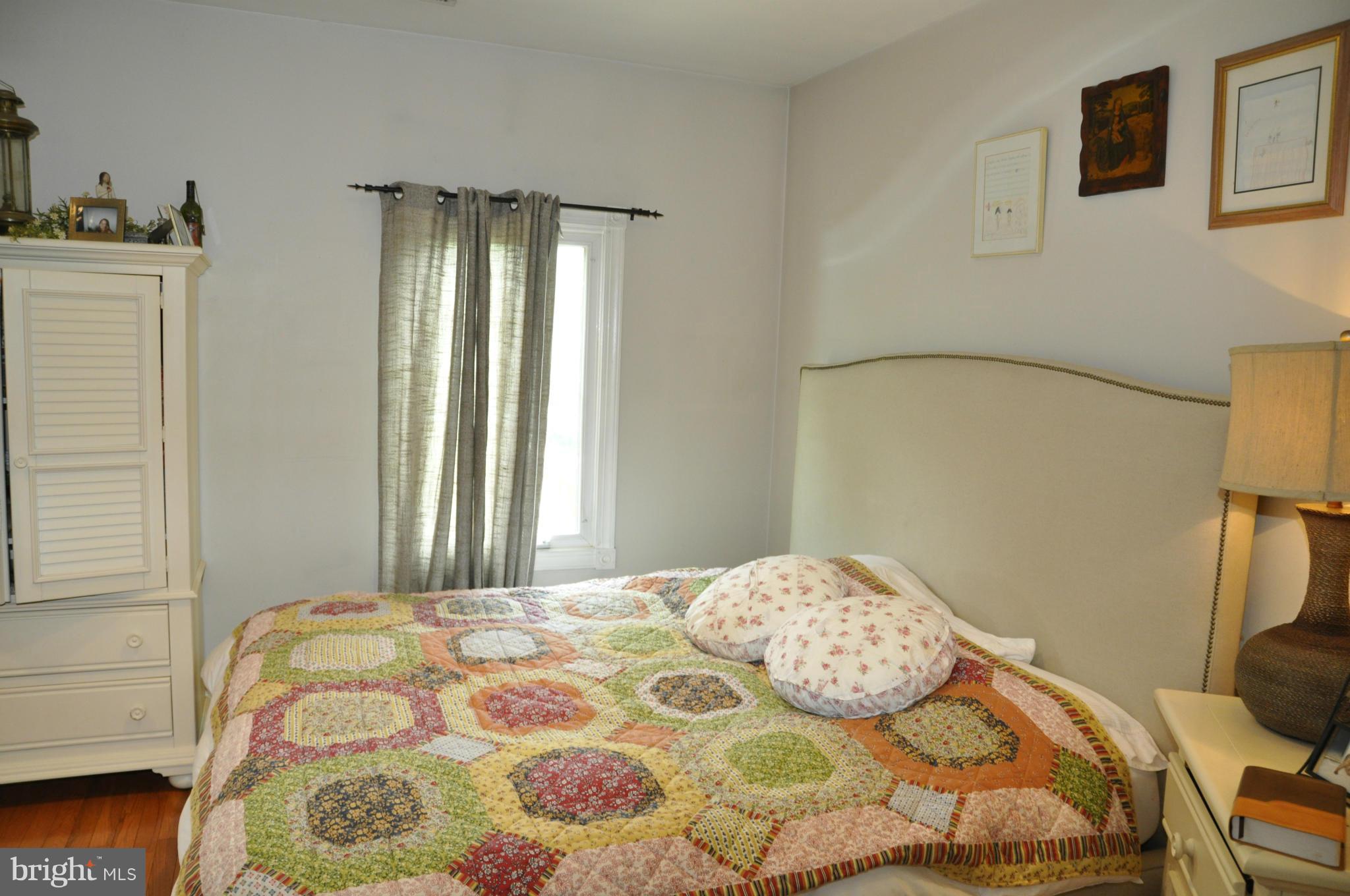 113 River Road Occoquan, VA 22125 - Photo 9 of 18 a bedroom with a bed and a window