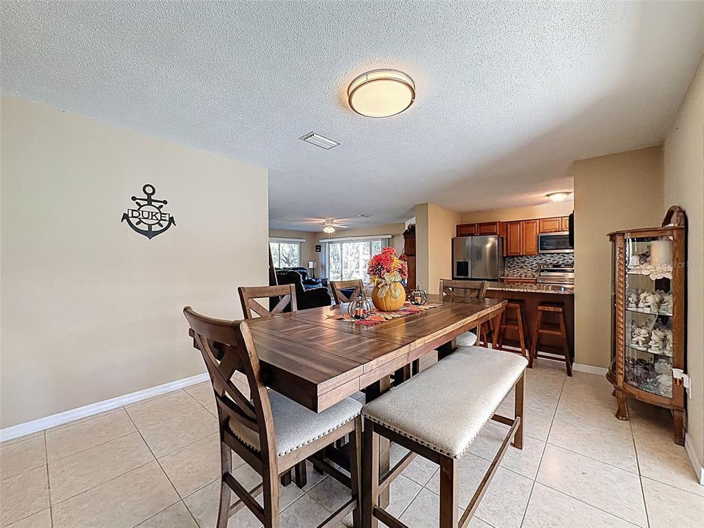 8716 Green Street Port Richey, FL 34668 - Photo 13 of 42 a view of a dining room with furniture