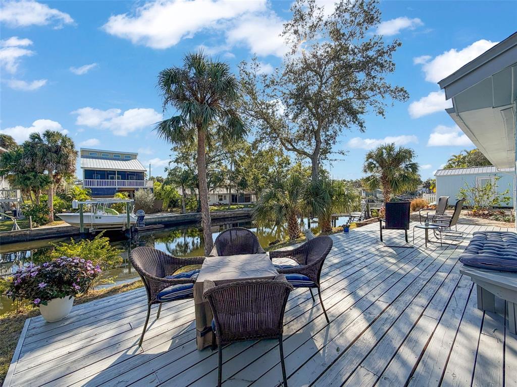 8716 Green Street Port Richey, FL 34668 - Photo 26 of 42 a view of a chairs and table on the wooden floor