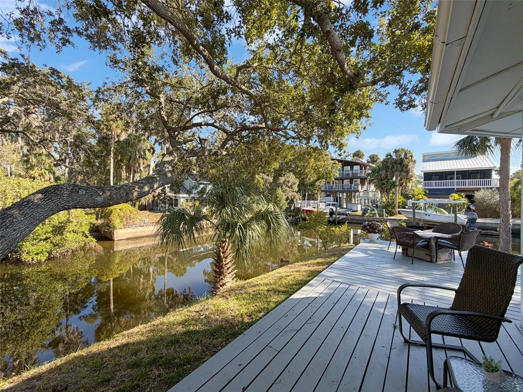8716 Green Street Port Richey, FL 34668 - Photo 27 of 42 a view of a chairs and table on the wooden floor