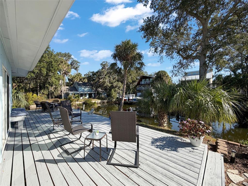 8716 Green Street Port Richey, FL 34668 - Photo 28 of 42 a view of a chairs and table on the wooden floor