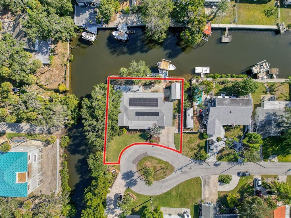 8716 Green Street Port Richey, FL 34668 - Photo 3 of 42 an aerial view of a house with a swimming pool and outdoor space