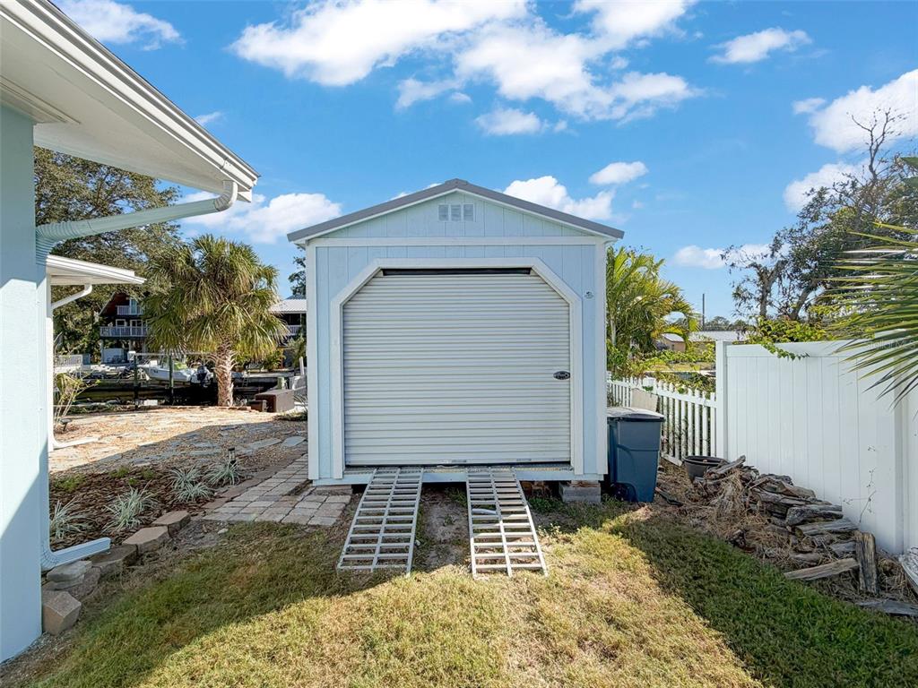 8716 Green Street Port Richey, FL 34668 - Photo 37 of 42 a view of a house with a yard