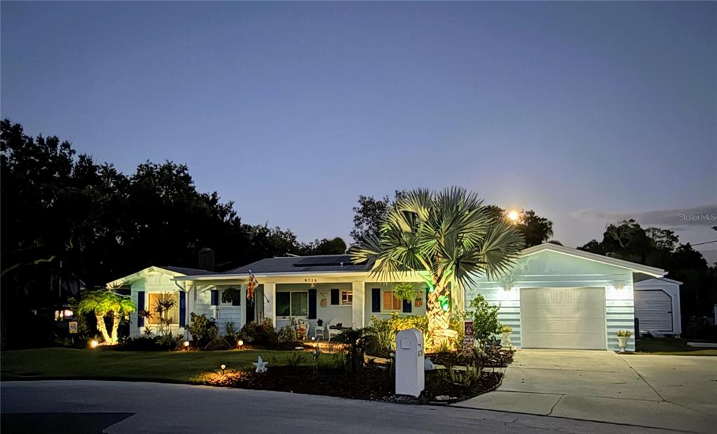 8716 Green Street Port Richey, FL 34668 - Photo 42 of 42 a front view of a house with garden