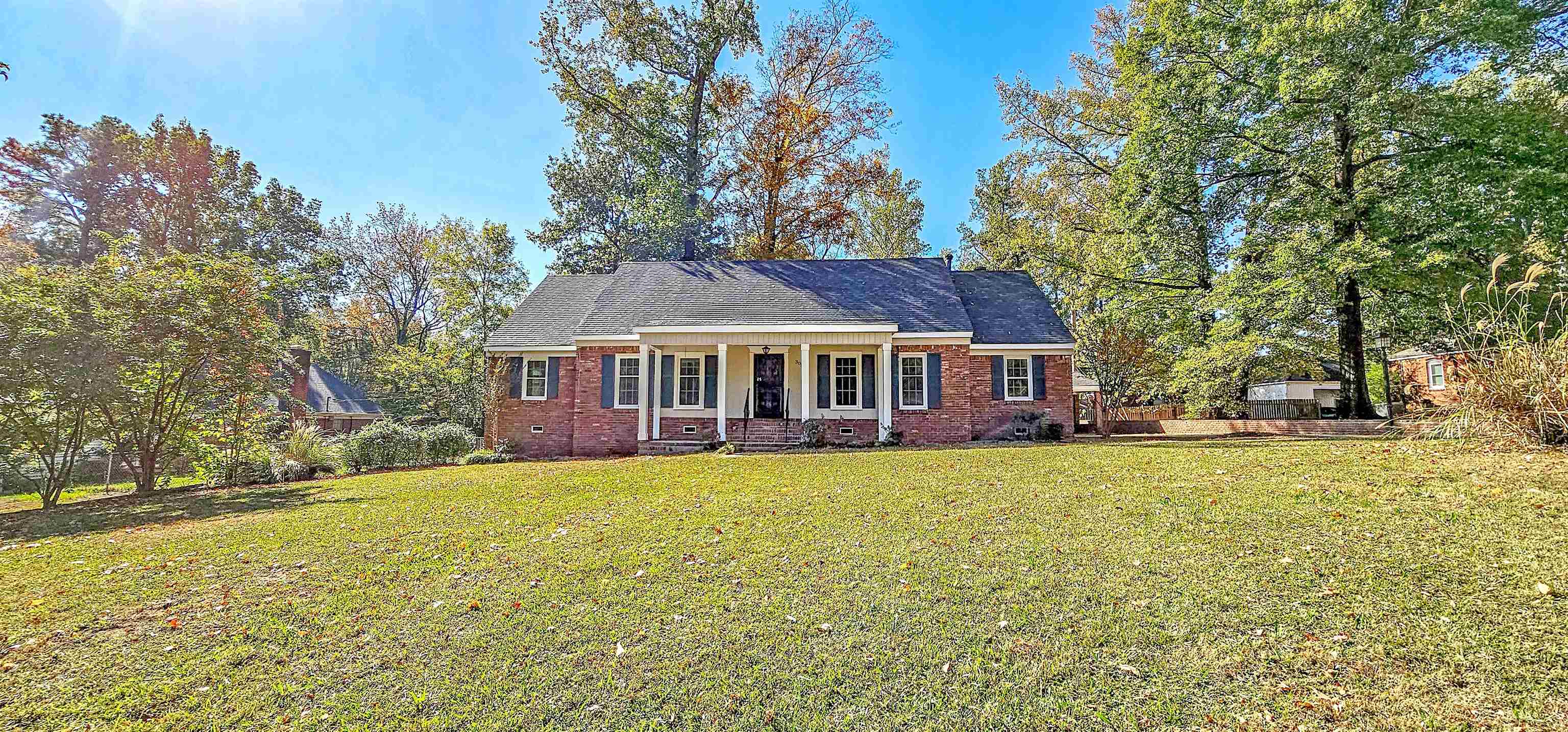 3086 Bannockburn Road Memphis, TN 38128 - Photo 3 of 40 a front view of a house with garden
