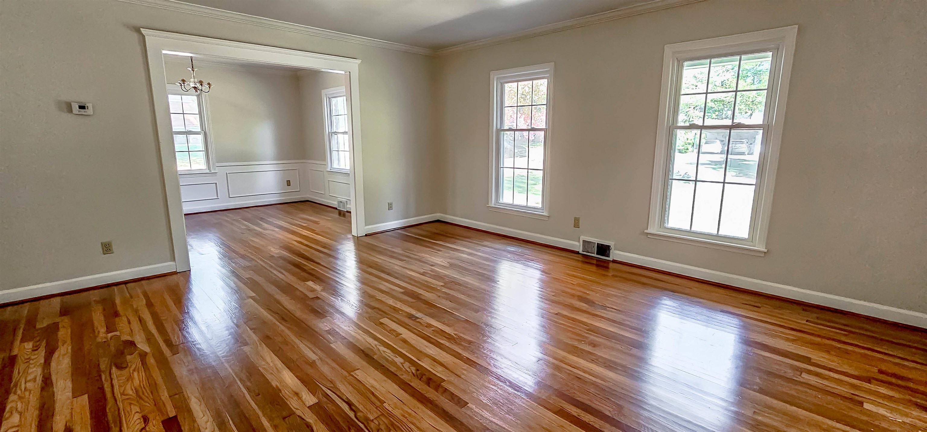 3086 Bannockburn Road Memphis, TN 38128 - Photo 7 of 40 an empty room with wooden floor and windows