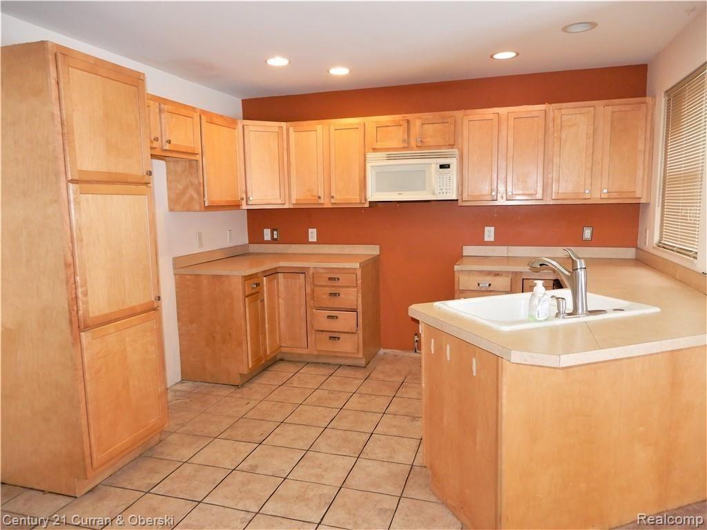 3500 West Seven Mile Road Detroit, MI 48221 - Photo 4 of 23 large kitchen with newer cabinets, tile, counters & recessed lighting