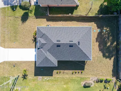 an aerial view of a house with swimming pool