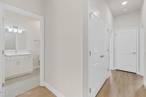a white bath tub sitting next to a white toilet