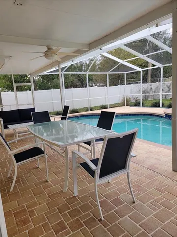 a outdoor space with a couch and chairs