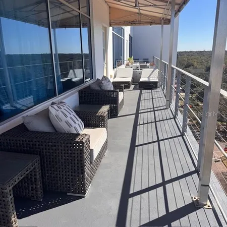 a bedroom with furniture and a flat screen tv