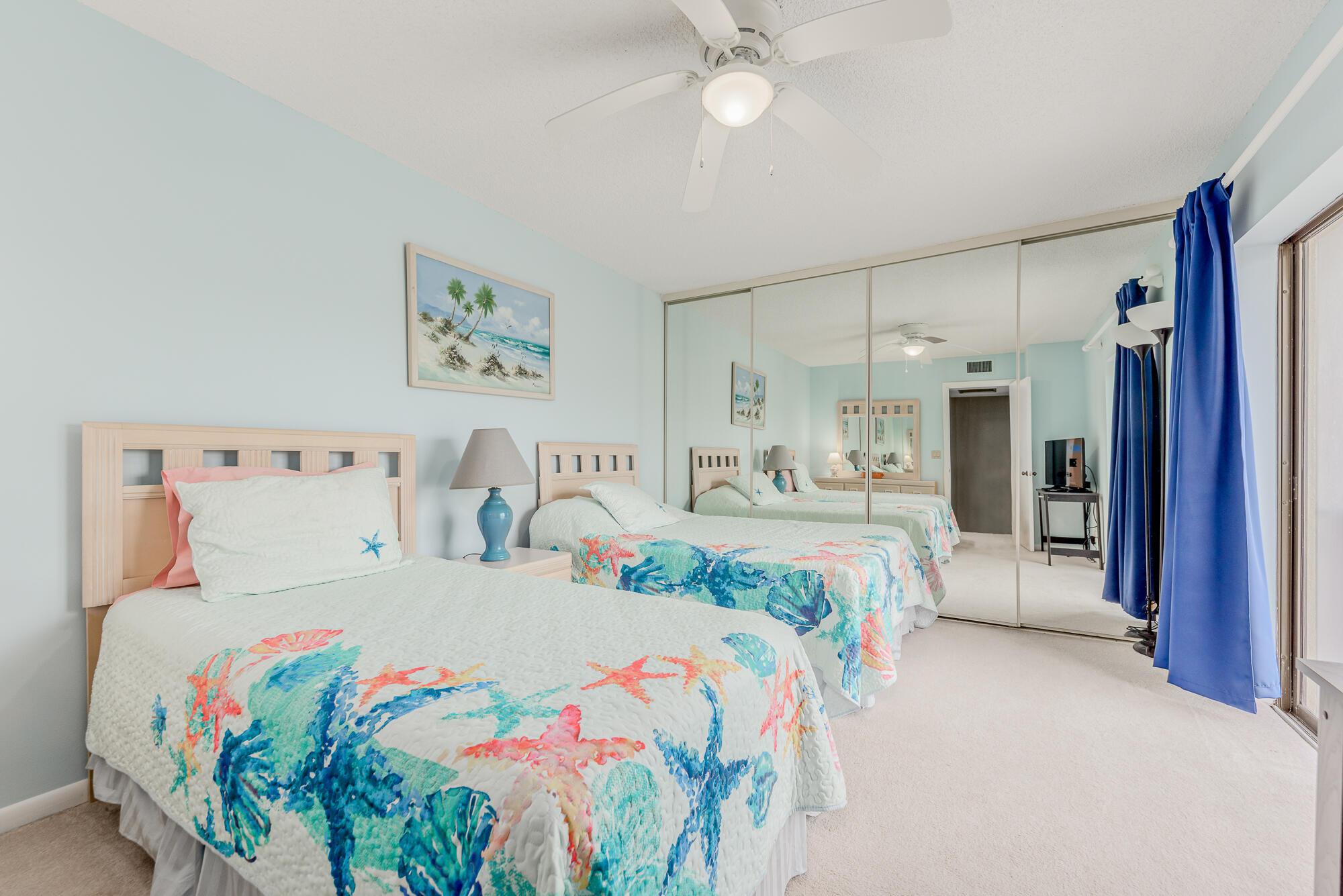 Undisclosed Address Stuart, FL 34997 - Photo 14 of 20 a bedroom with a large bed and a chandelier