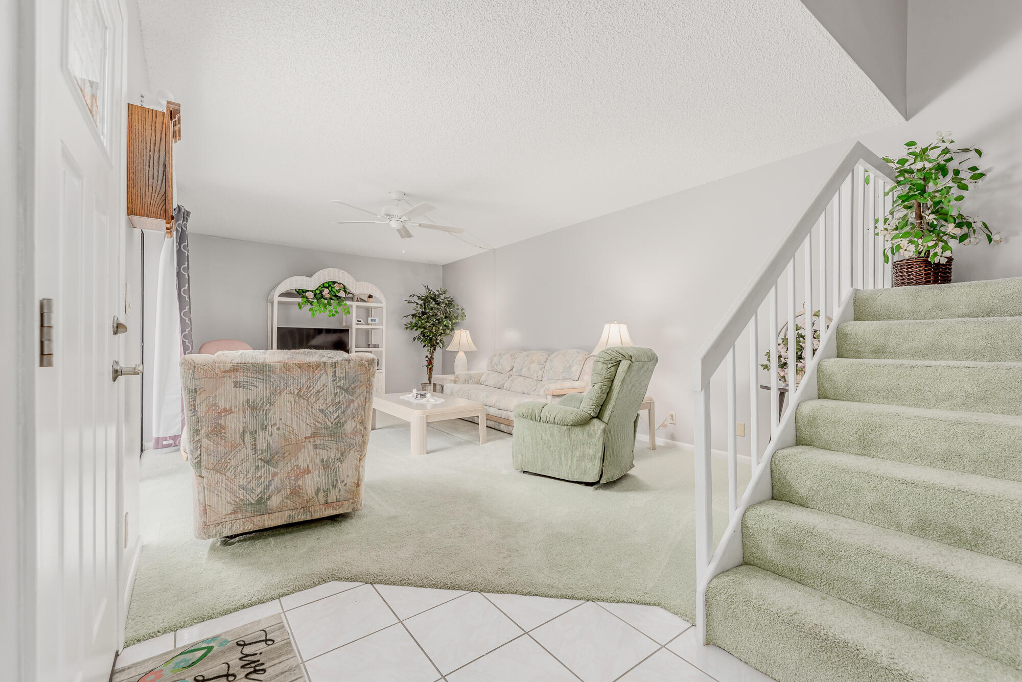 Undisclosed Address Stuart, FL 34997 - Photo 5 of 20 a living room with furniture and stairs