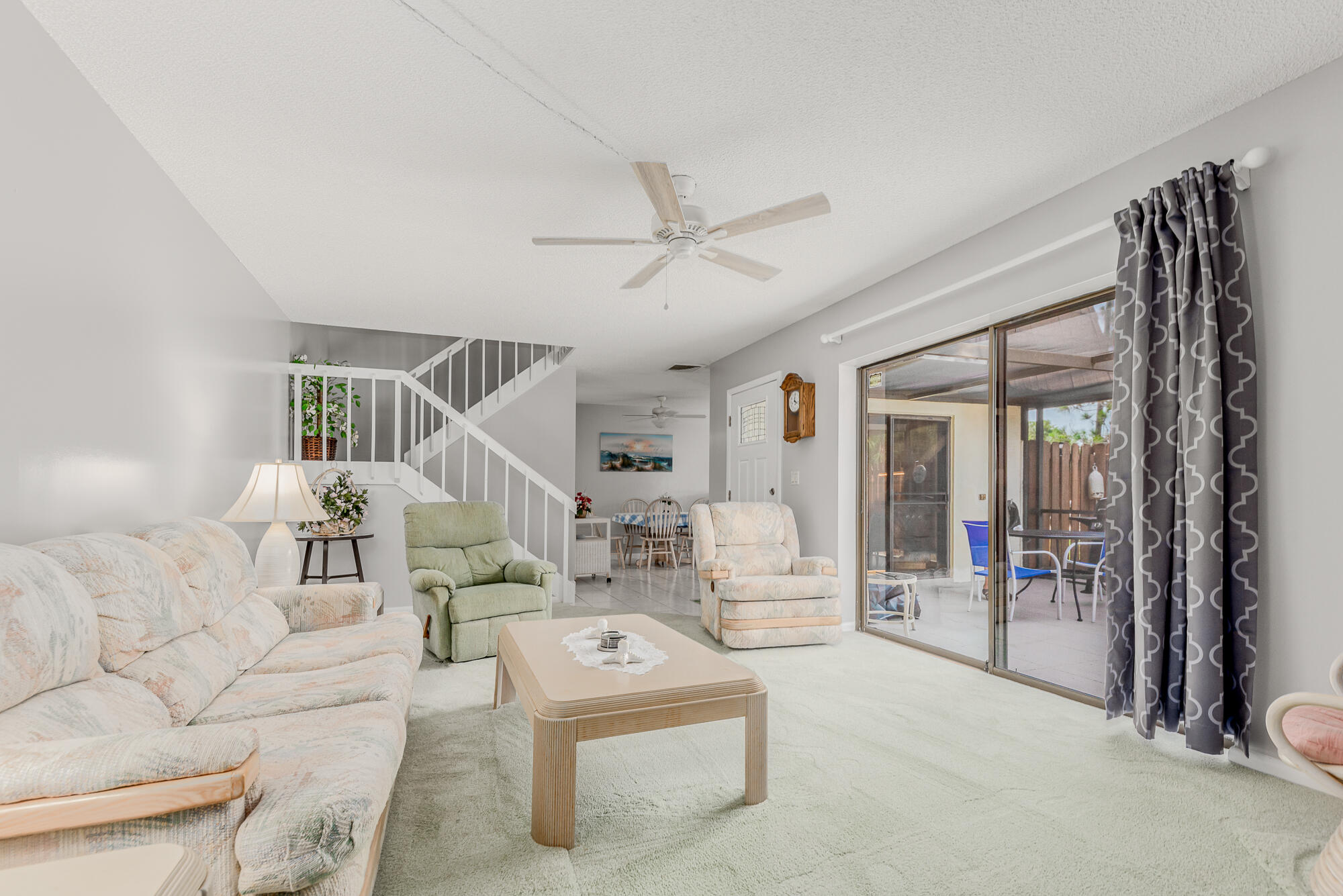 Undisclosed Address Stuart, FL 34997 - Photo 6 of 20 a living room with furniture and a floor to ceiling window