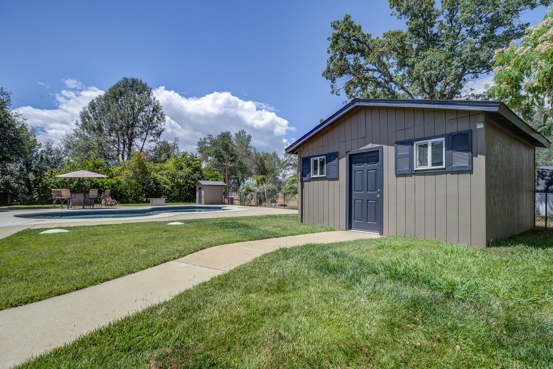 17536 Oly Way Anderson, CA 96007 - Photo 34 of 51 a front view of house with yard and green space