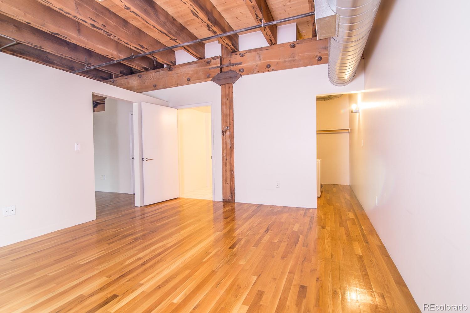 1801 Wynkoop Street, Unit 315 Denver, CO 80202 - Photo 13 of 26 a view of empty room with wooden floor