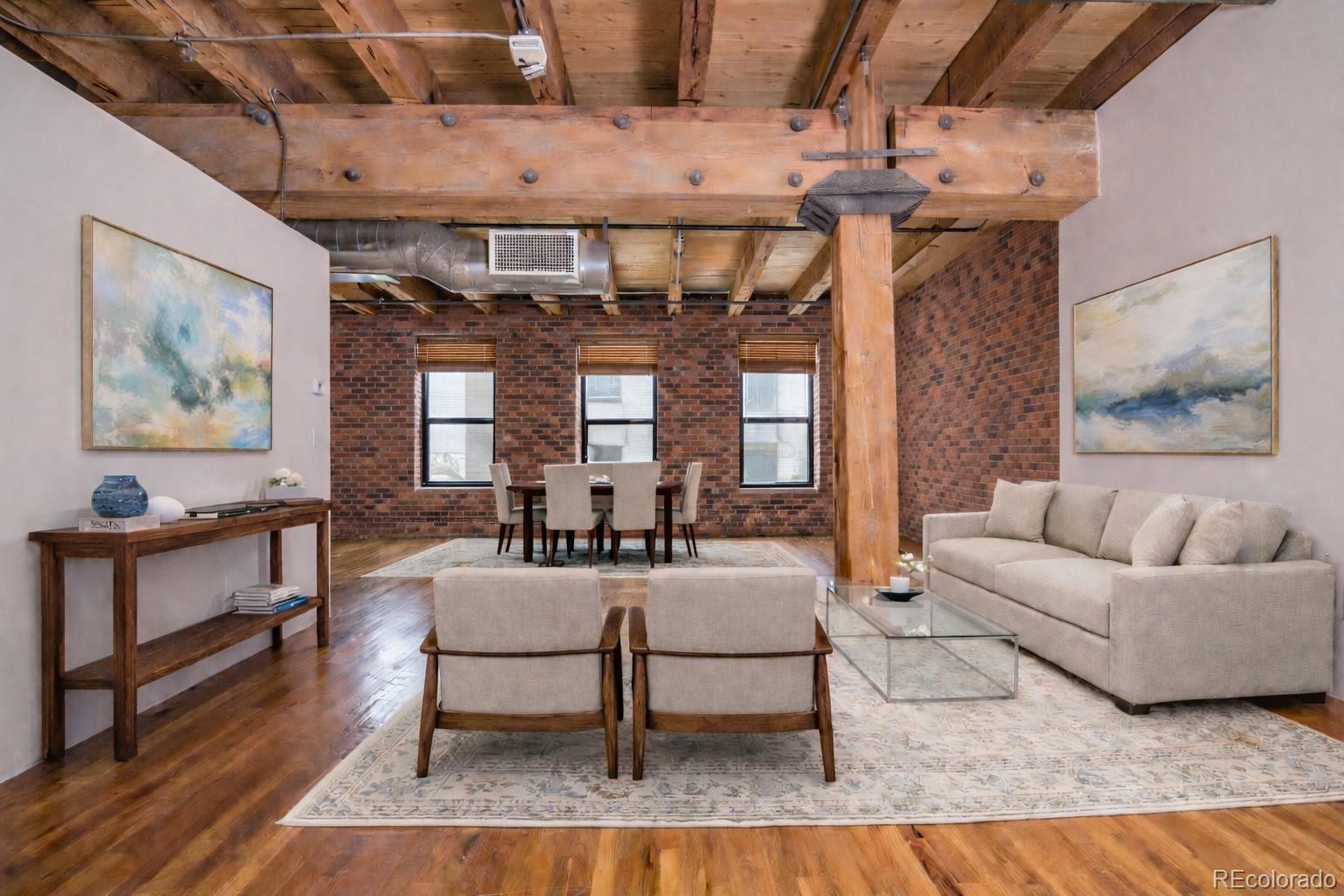 1801 Wynkoop Street, Unit 315 Denver, CO 80202 - Photo 2 of 26 a living room with furniture and wooden floor