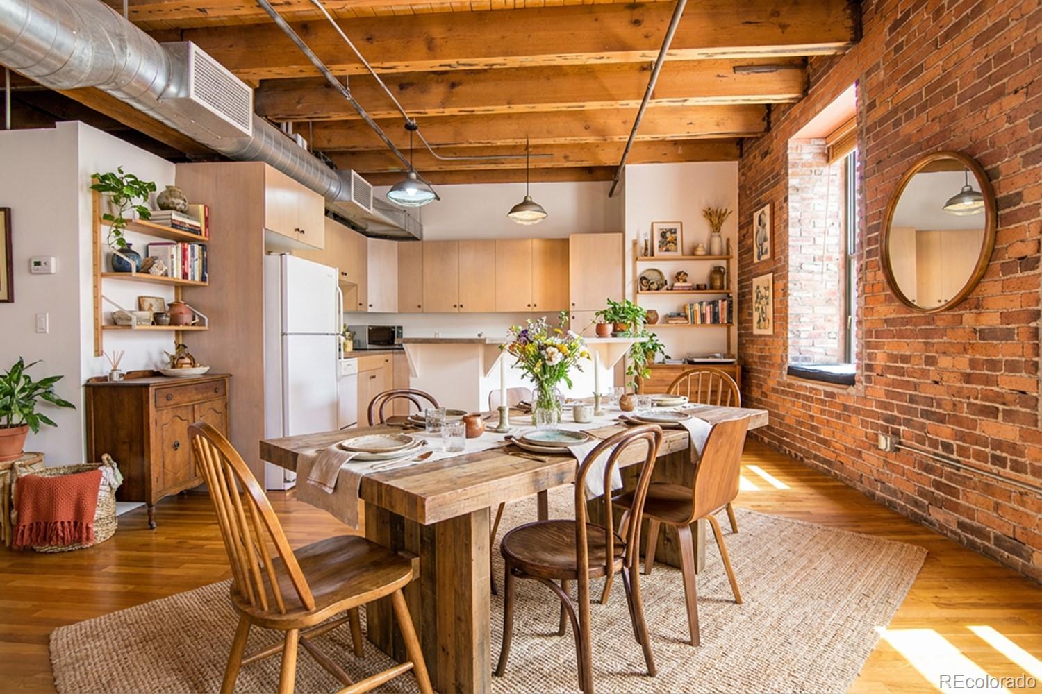 1801 Wynkoop Street, Unit 315 Denver, CO 80202 - Photo 25 of 26 a view of a dining room with furniture and a chandelier