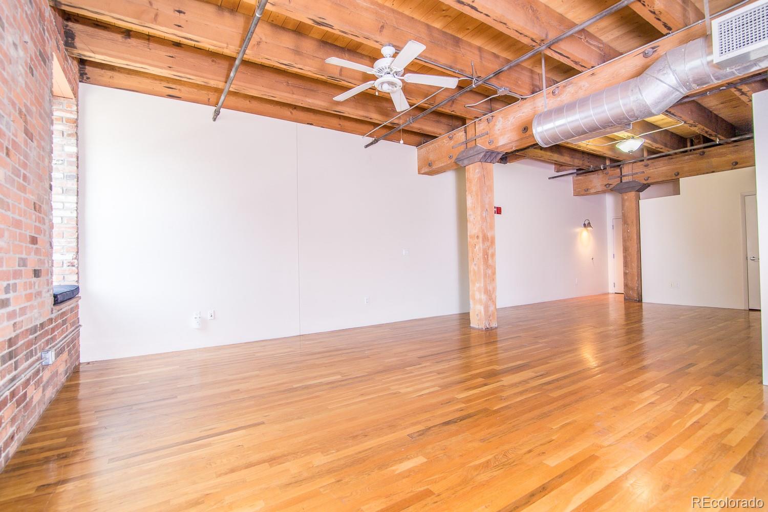 1801 Wynkoop Street, Unit 315 Denver, CO 80202 - Photo 3 of 26 a view of a room with wooden floor