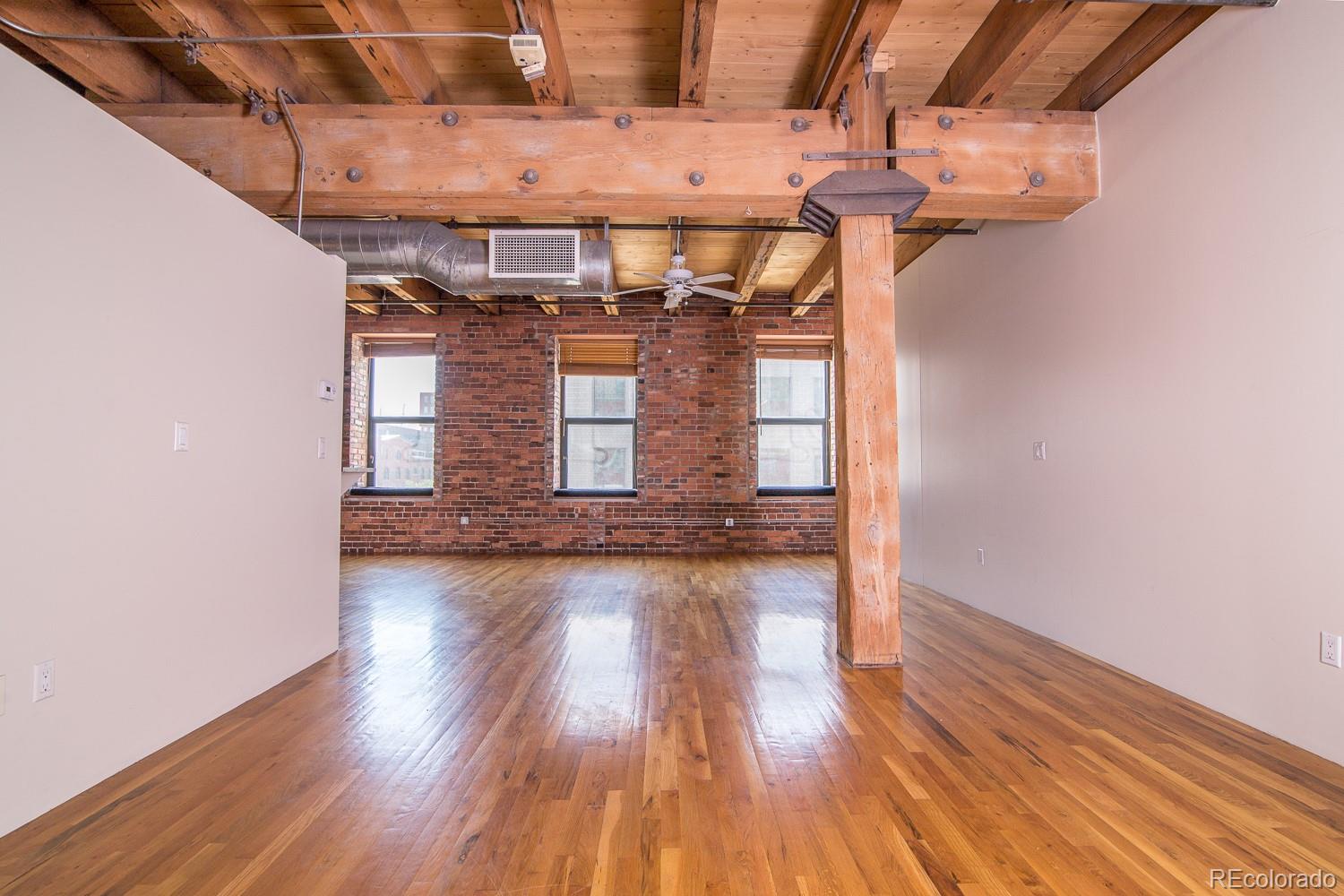 1801 Wynkoop Street, Unit 315 Denver, CO 80202 - Photo 4 of 26 a view of a room with wooden floor