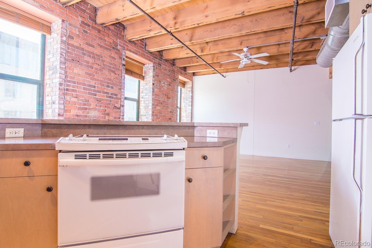 1801 Wynkoop Street, Unit 315 Denver, CO 80202 - Photo 10 of 26 a stove top oven sitting inside of a kitchen