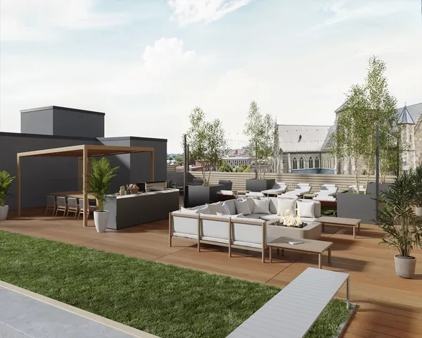 a view of a patio with couches and a table and chairs with garden in it