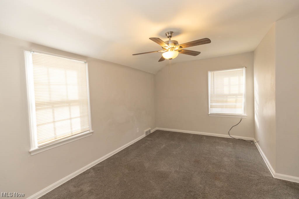 3890 Wallingford Road South Euclid, OH 44121 - Photo 13 of 19 Empty room featuring dark carpet and ceiling fan