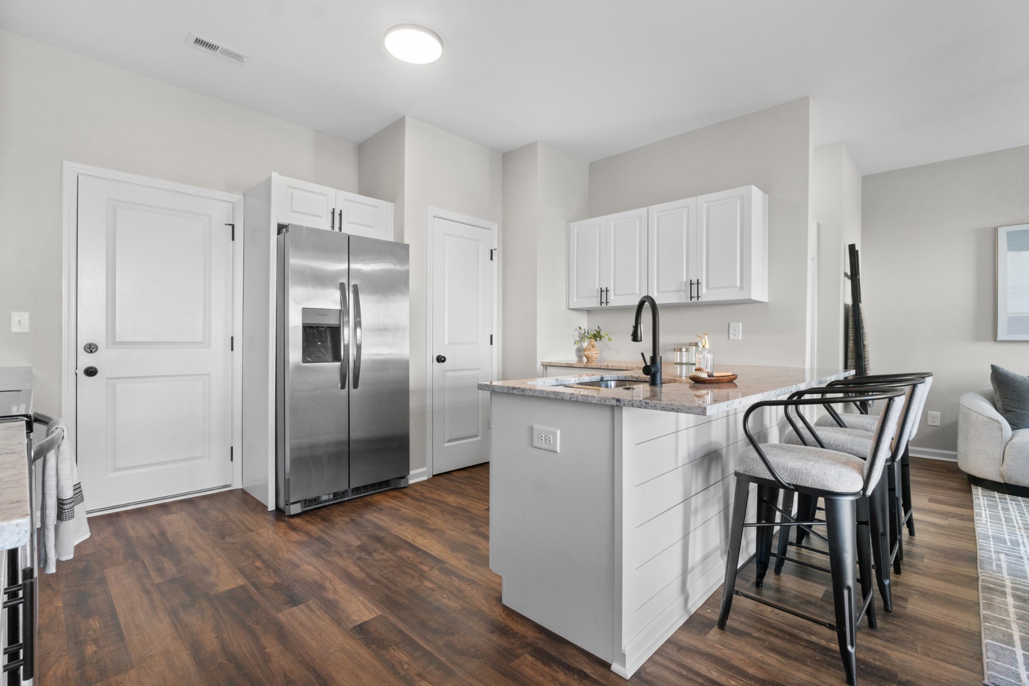 a kitchen with a sink cabinets and stainless steel appliances