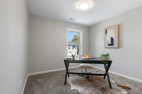 a workspace with furniture and window