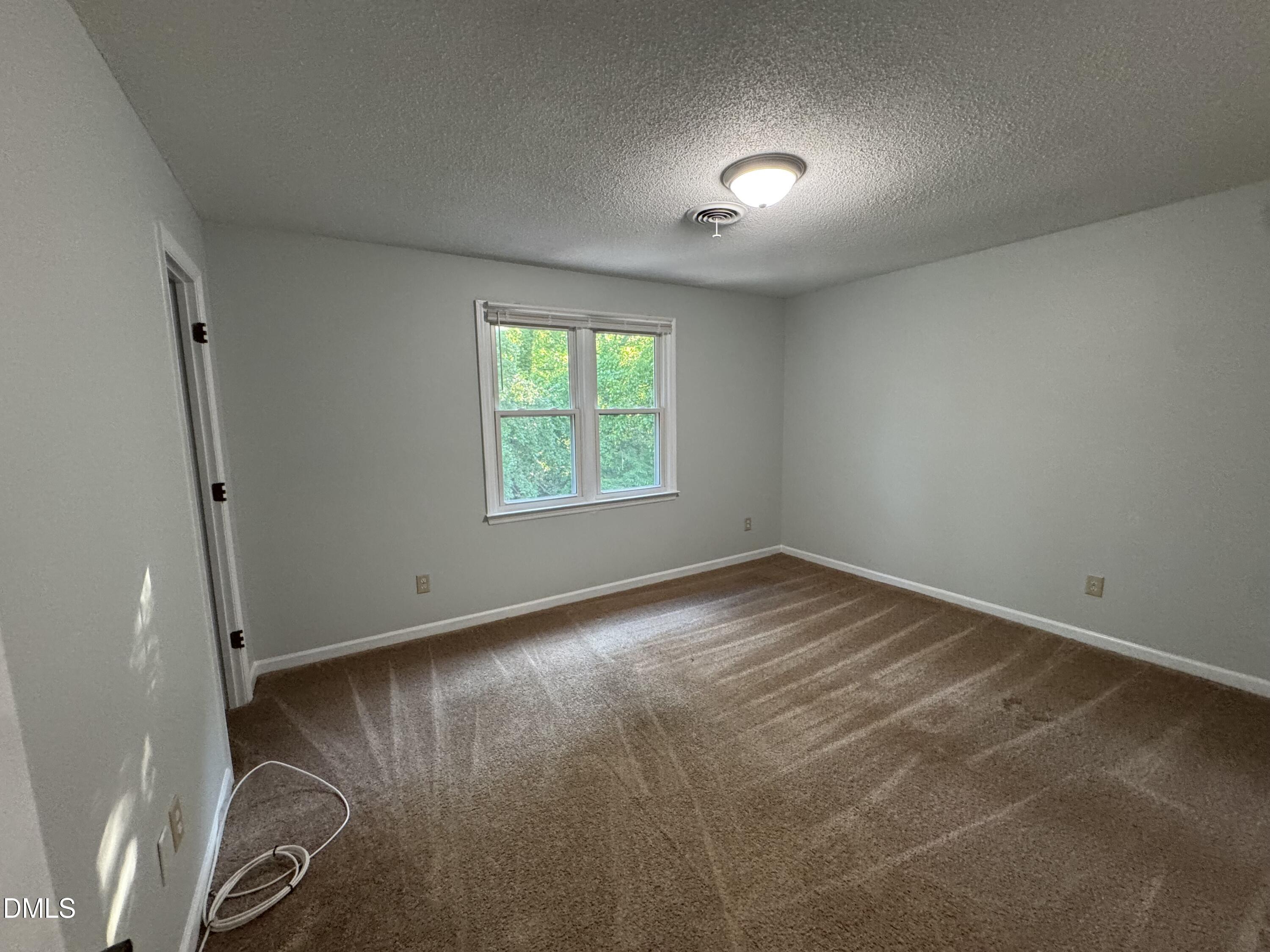 4200 Bertram Drive Raleigh, NC 27604 - Photo 11 of 16 an empty room with a window