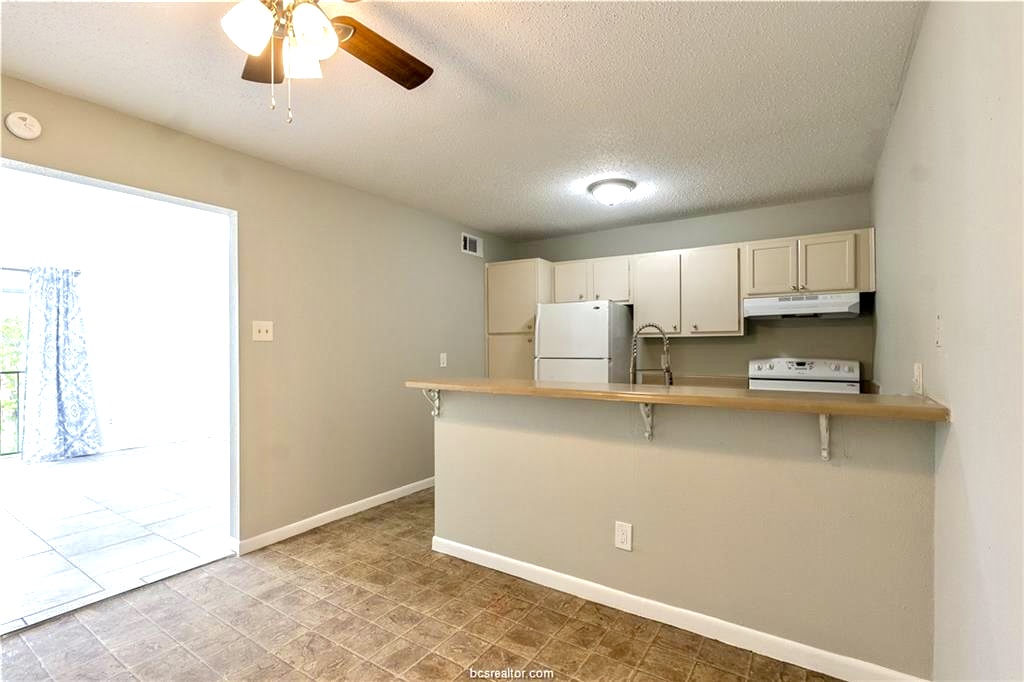 2000 Kazmeier, Unit 42 Bryan, TX 77802 - Photo 9 of 14 a kitchen with stainless steel appliances a refrigerator sink and stove