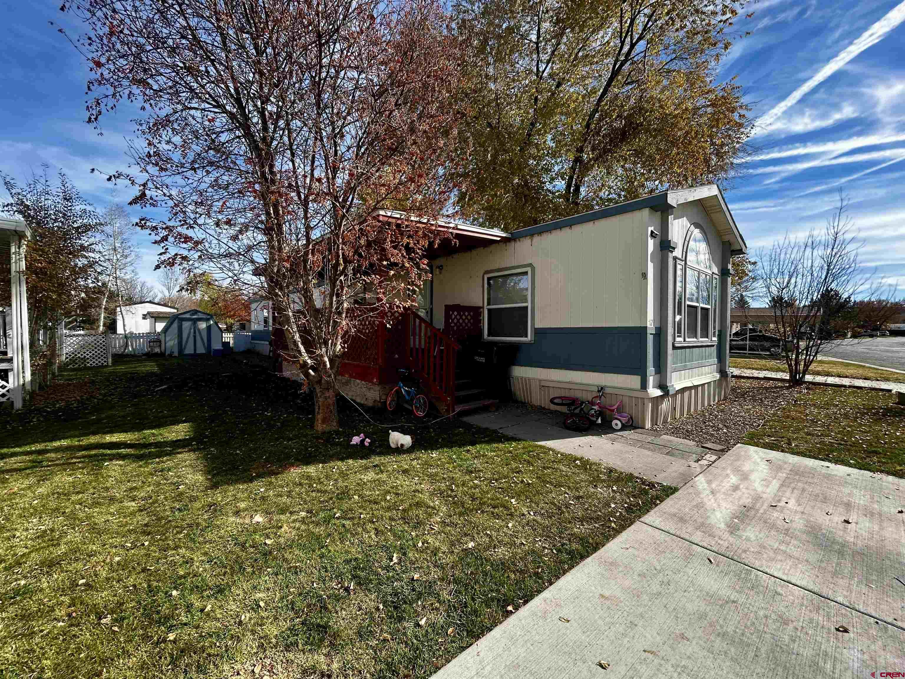 62880 Lasalle Road, Unit 129 Montrose, CO 81401 - Photo 2 of 4 a view of a house with a yard
