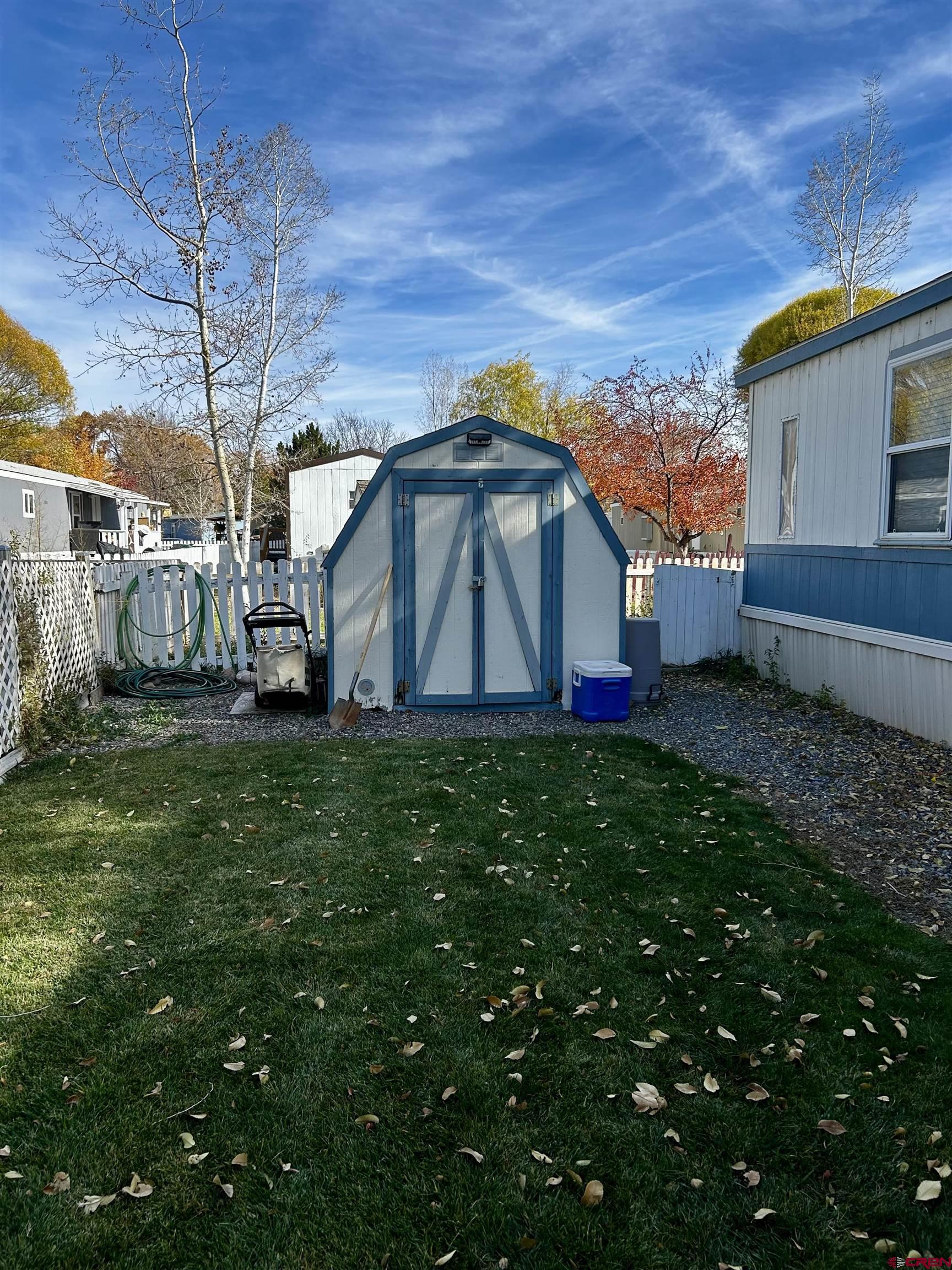 62880 Lasalle Road, Unit 129 Montrose, CO 81401 - Photo 3 of 4 a view of house with backyard