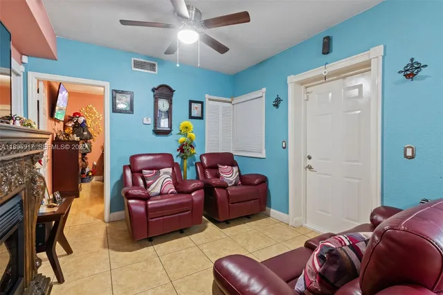 a bedroom with furniture and a fireplace