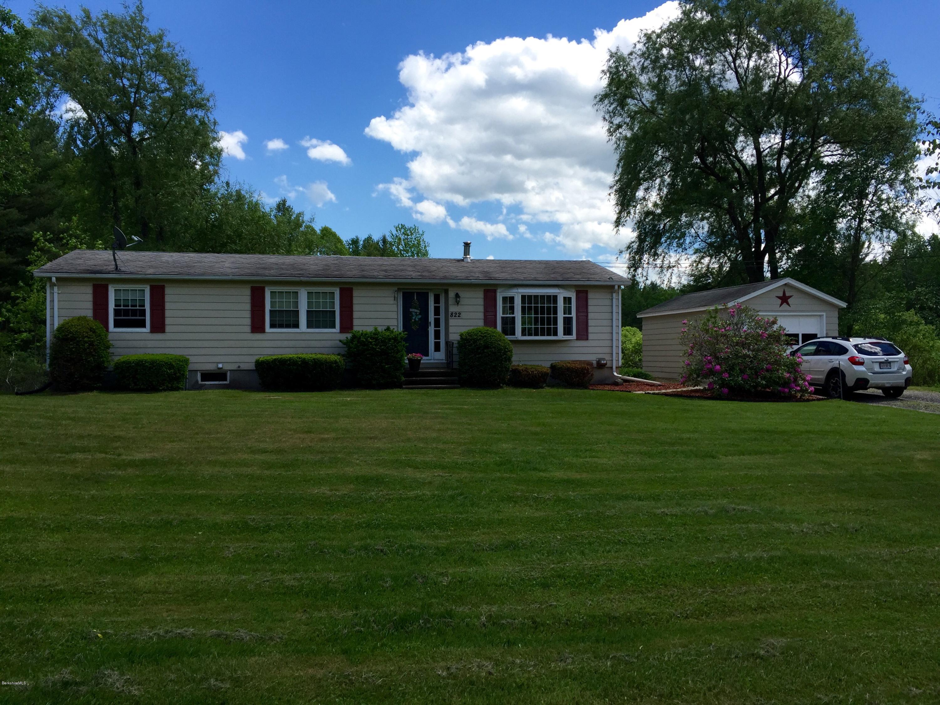 822 Middle Road Clarksburg, MA 01247 - Photo 1 of 14 a front view of a house with a garden
