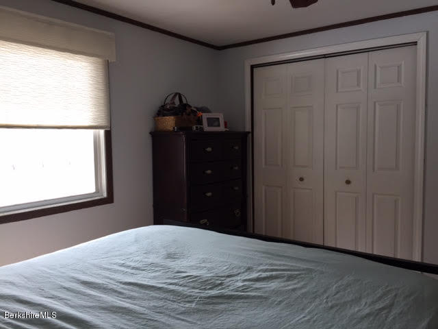822 Middle Road Clarksburg, MA 01247 - Photo 13 of 14 a bedroom with a bed and a window