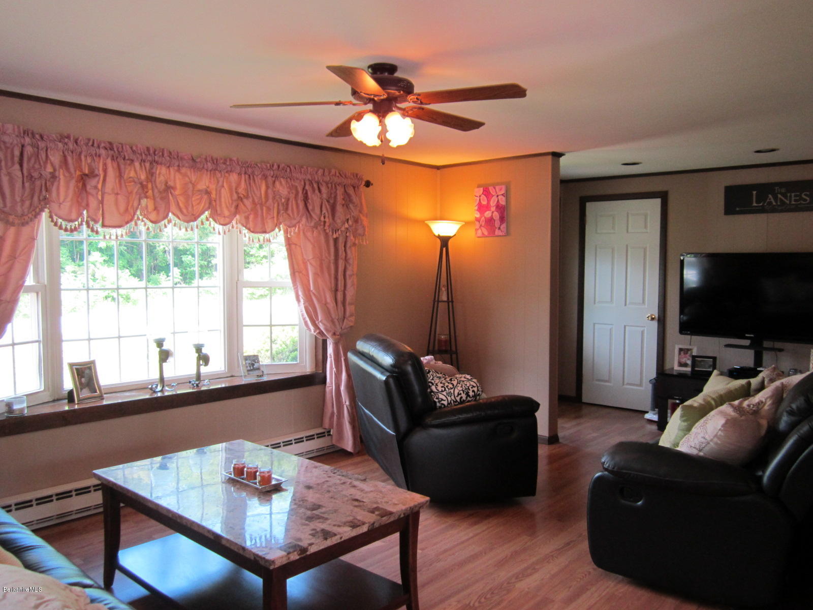 822 Middle Road Clarksburg, MA 01247 - Photo 4 of 14 a living room with furniture and a flat screen tv