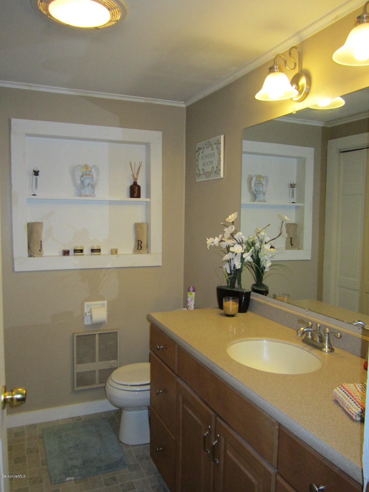 822 Middle Road Clarksburg, MA 01247 - Photo 5 of 14 a bathroom with a sink a toilet and a mirror