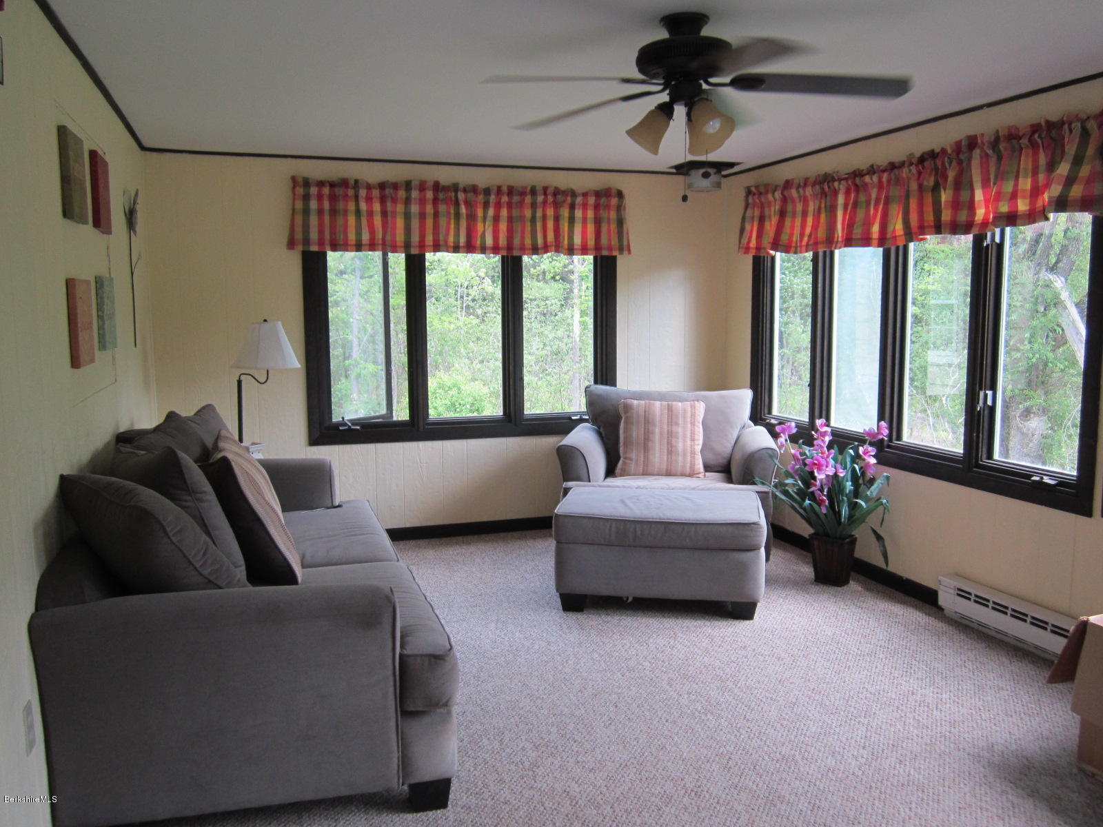 822 Middle Road Clarksburg, MA 01247 - Photo 7 of 14 a living room with furniture and a large window