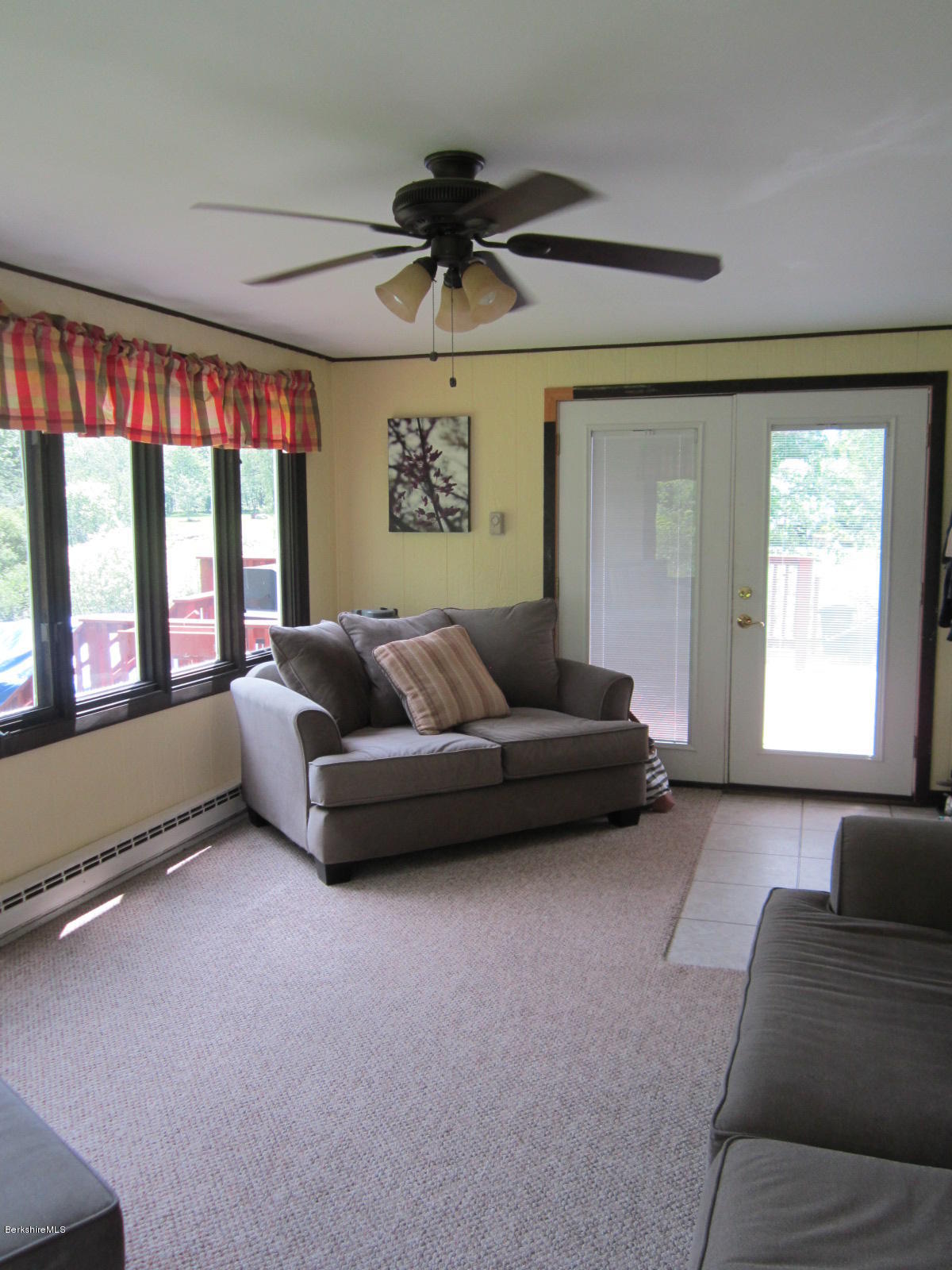 822 Middle Road Clarksburg, MA 01247 - Photo 8 of 14 a living room with furniture and a large window