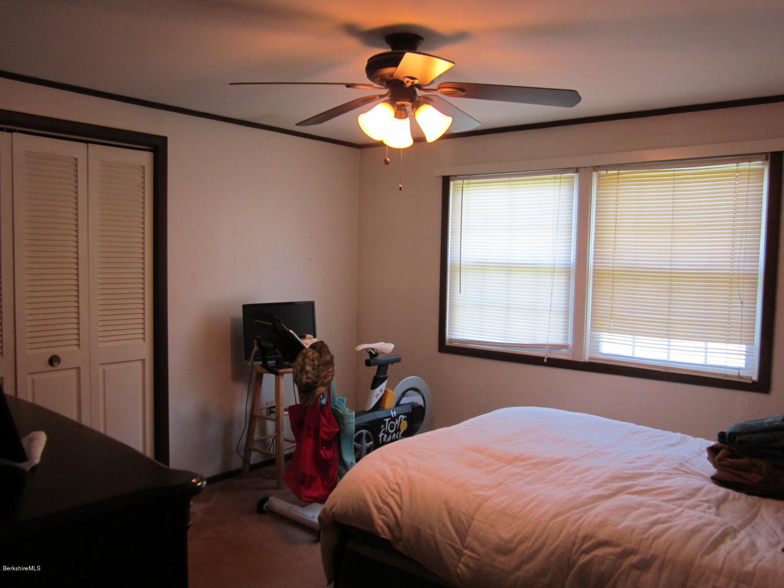 822 Middle Road Clarksburg, MA 01247 - Photo 9 of 14 a bed sitting in a bedroom next to a window