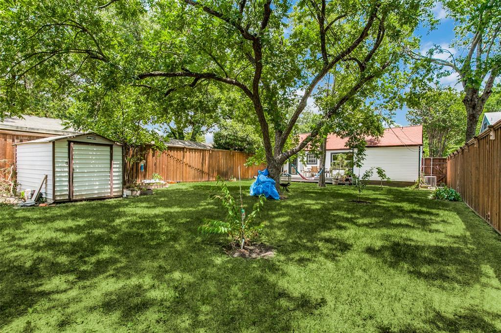 8619 Angora Street Dallas, TX 75218 - Photo 23 of 24 View of yard with a shed