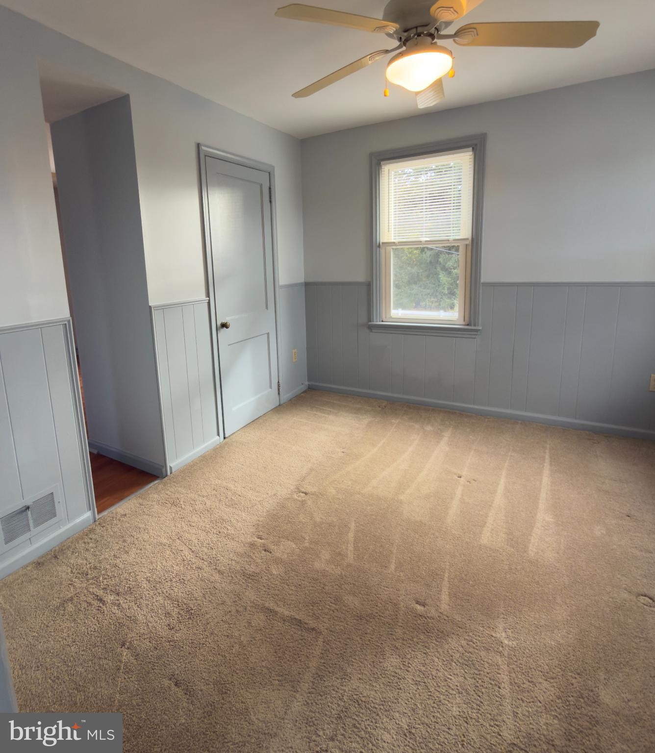 532 Lehigh Avenue, Unit 2 Swarthmore, PA 19081 - Photo 3 of 7 an empty room with windows and closet