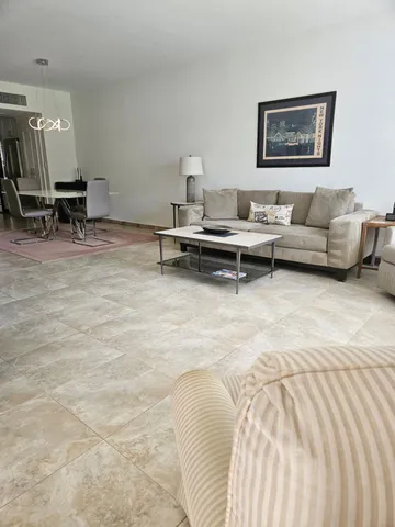 a living room with furniture and a table