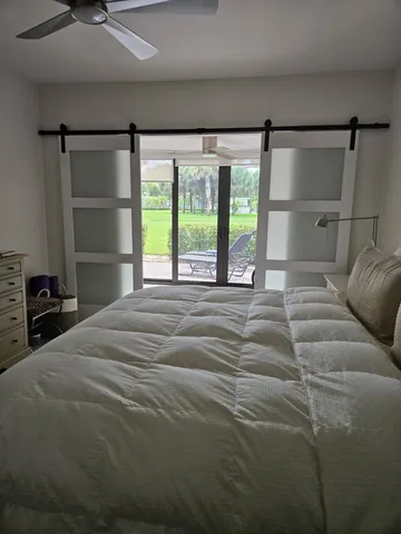 a bed room with a bed and a window