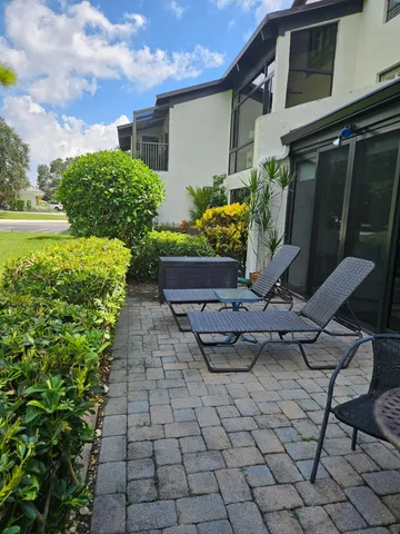 a front view of a house with lots of yellow lighting