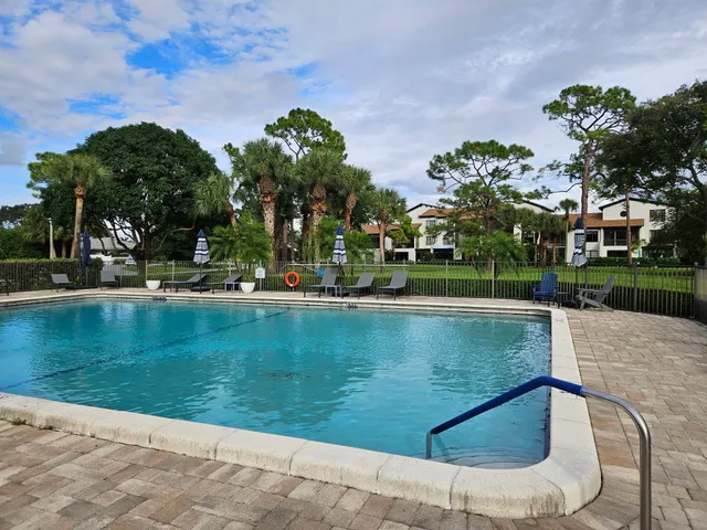 a view of a backyard with sitting area