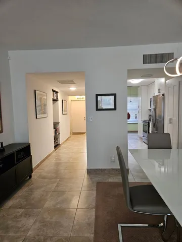 a view of kitchen with furniture and window