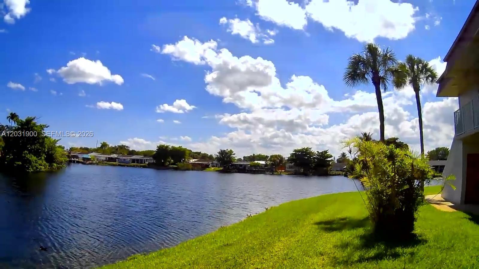 12860 Southwest 43rd Drive, Unit 146B Miami, FL 33175 - Photo 1 of 12 a view of a lake with a terrace