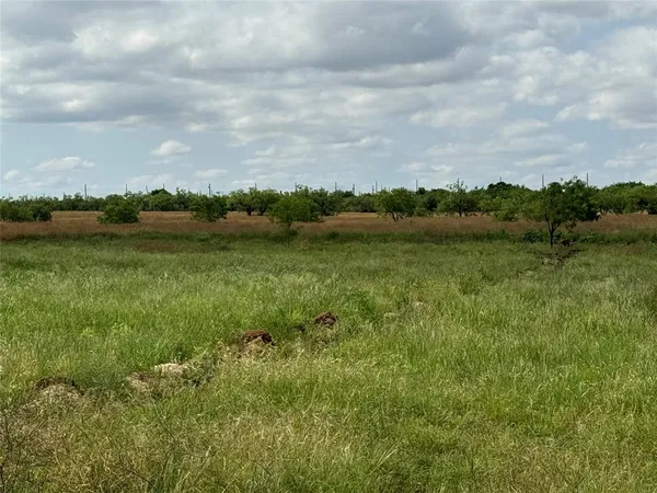 a view of a lake with houses in the back